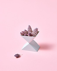 Image showing Creative composition of two cardboard boxes with cones on a pink background with space for text. Autumn layout