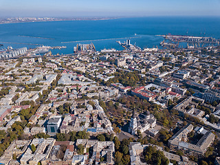 Image showing Panoramic view of the city of Odessa, from Spaso-Preobrazhensky Cathedral and sea port on a background of blue sky. Ukraine. Aerial view from the drone