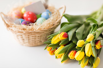 Image showing close up of colored easter eggs and tulip flowers