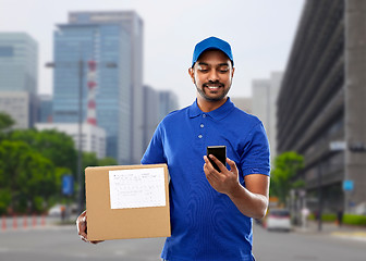 Image showing indian delivery man with smartphone and parcel box