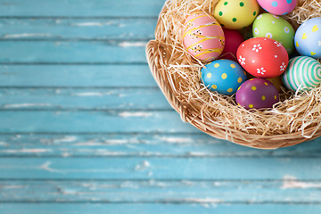 Image showing close up of colored easter eggs in basket