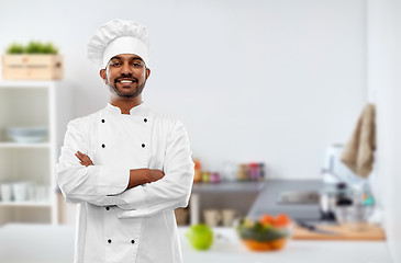 Image showing happy male indian chef in toque at kitchen