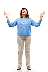 Image showing happy senior woman looking up