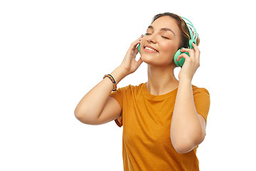 Image showing happy young woman or teenage girl with headphones