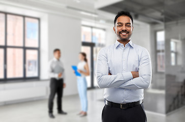 Image showing indian businessman or realtor in empty office room