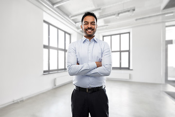 Image showing indian businessman or realtor in empty office room