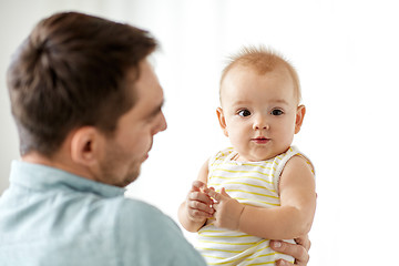 Image showing father with little baby daughter on white