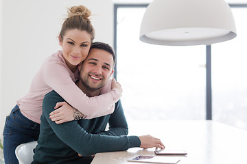 Image showing couple hugging in their new home