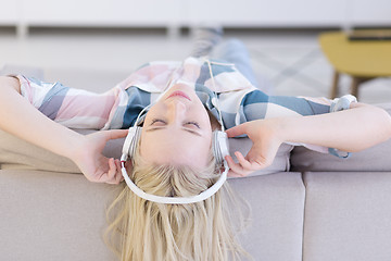 Image showing girl enjoying music through headphones