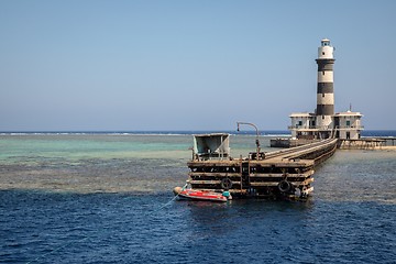 Image showing Tall lighthouse on the sea