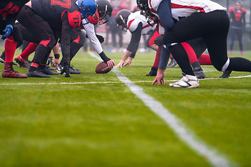 Image showing professional american football players ready to start