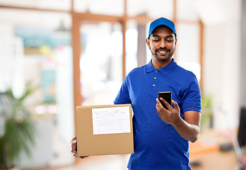 Image showing indian delivery man with smartphone and parcel box