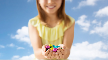 Image showing close up of girl holding chocolate easter eggs