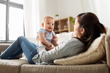 Image showing happy mother with little baby son at home