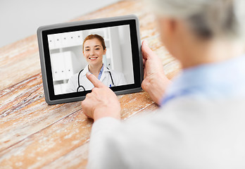 Image showing senior woman patient having video call with doctor