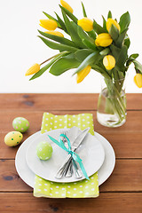 Image showing easter egg, plates, cutlery and tulip flowers