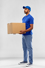 Image showing indian delivery man with parcel box in blue