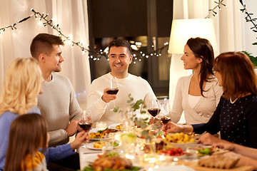 Image showing happy family having dinner party at home