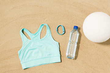 Image showing sports top, ball, fitness tracker and water bottle