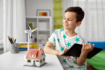 Image showing boy with tablet, toy house and wind turbine