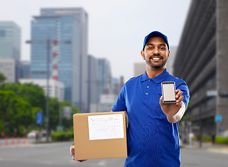 Image showing indian delivery man with smartphone and parcel box