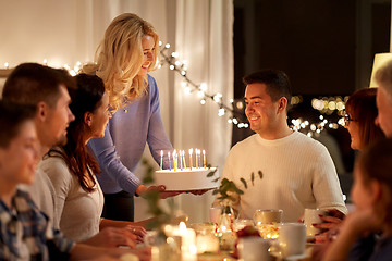 Image showing  happy family with cake having birthday party