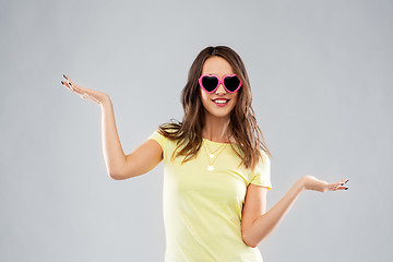 Image showing teenage girl in heart-shaped sunglasses