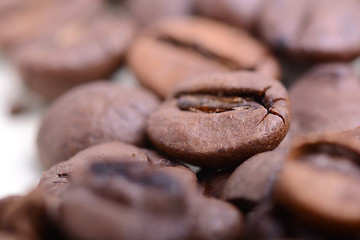 Image showing Roasted coffee bean close up. Food background