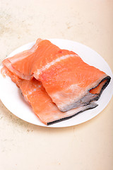 Image showing fresh salmon fillet close up on white plate