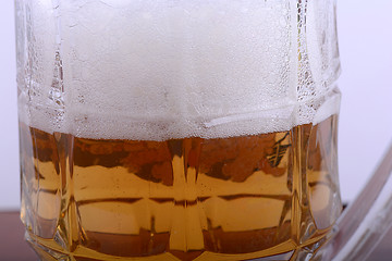 Image showing Mug fresh beer with cap of foam close up