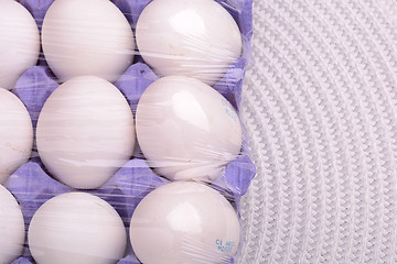 Image showing Raw chicken eggs set on white background