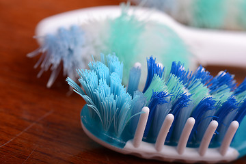 Image showing xtreme Macro close up of toothbrush with wooden background