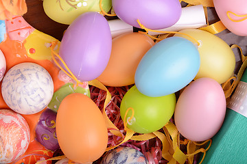 Image showing Handcrafted easter eggs close up, ribbons and decoration