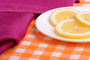 Image showing Lemon sliced lies on a plate shaped