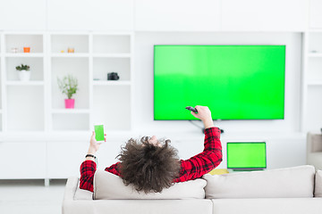 Image showing young man in bathrobe enjoying free time