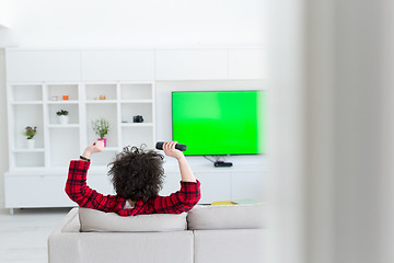 Image showing young man in bathrobe enjoying free time