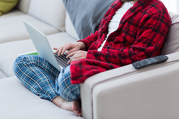 Image showing man freelancer in bathrobe working from home