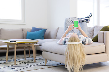 Image showing girl enjoying music through headphones