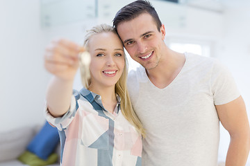 Image showing couple showing a keys of their new house