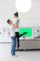 Image showing couple hugging in their new home