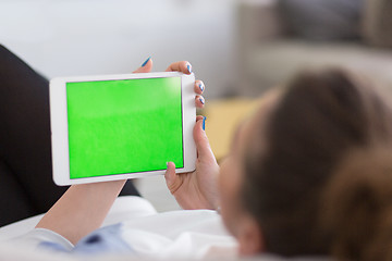 Image showing woman on sofa using tablet computer