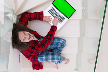 Image showing freelancer in bathrobe working from home