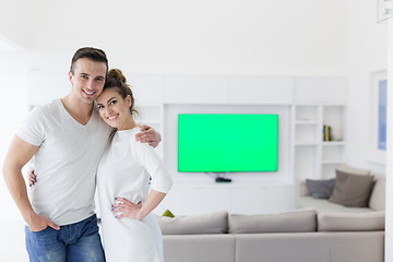 Image showing couple hugging in their new home