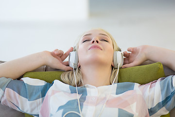 Image showing girl enjoying music through headphones