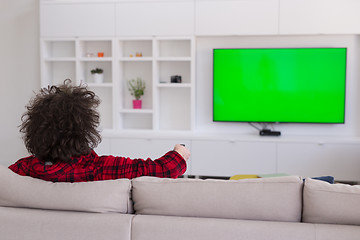 Image showing young man in bathrobe enjoying free time