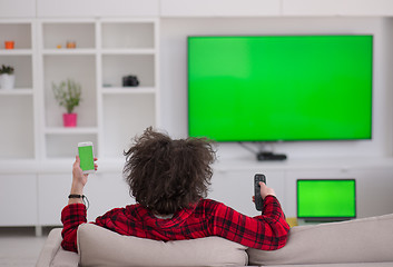 Image showing young man in bathrobe enjoying free time