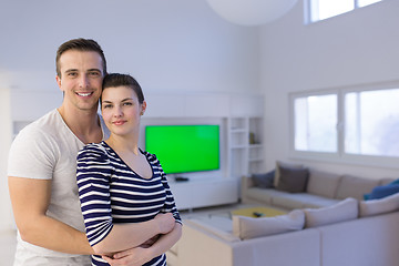 Image showing couple hugging in their new home