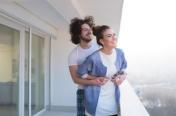 Image showing Couple hugging on the balcony