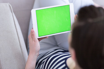 Image showing woman on sofa using tablet computer