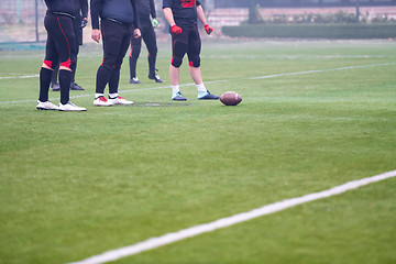 Image showing group of american football players practicing football kickoff